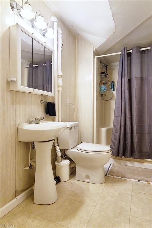 2301 Griffith Road Winston-Salem, NC 27103 - Photo 35 of 50 Full bathroom in basement area behind the bar room.