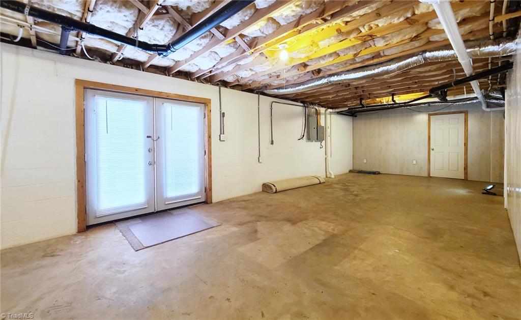 2301 Griffith Road Winston-Salem, NC 27103 - Photo 37 of 50 Unfished basement area with doors to the back yard