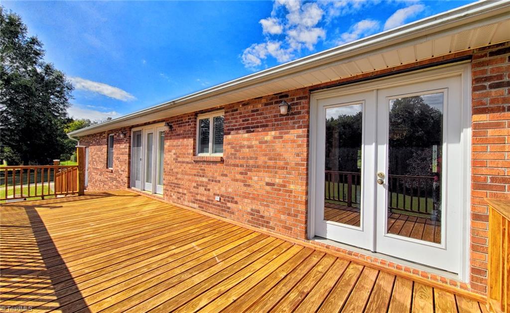 2301 Griffith Road Winston-Salem, NC 27103 - Photo 39 of 50 Back deck showing the dining room doors.