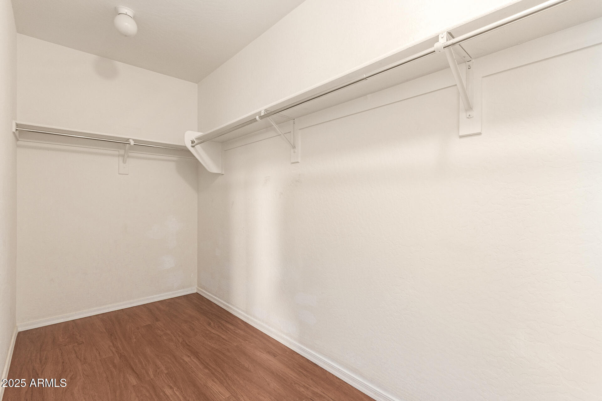 40214 West Lococo Street Maricopa, AZ 85138 - Photo 14 of 31 a view of a room with wooden floor