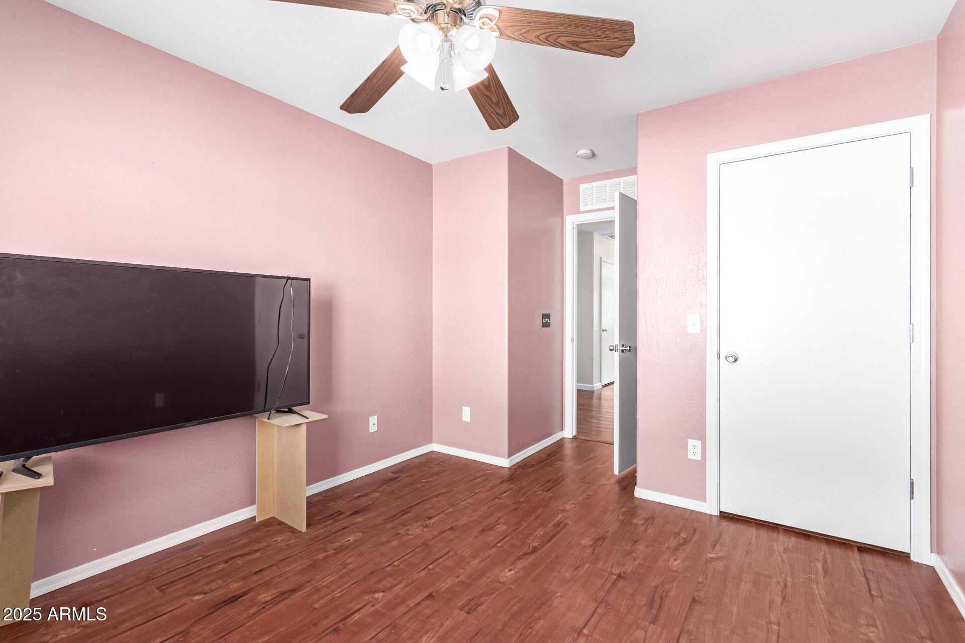 40214 West Lococo Street Maricopa, AZ 85138 - Photo 21 of 31 a view of a livingroom with wooden floor