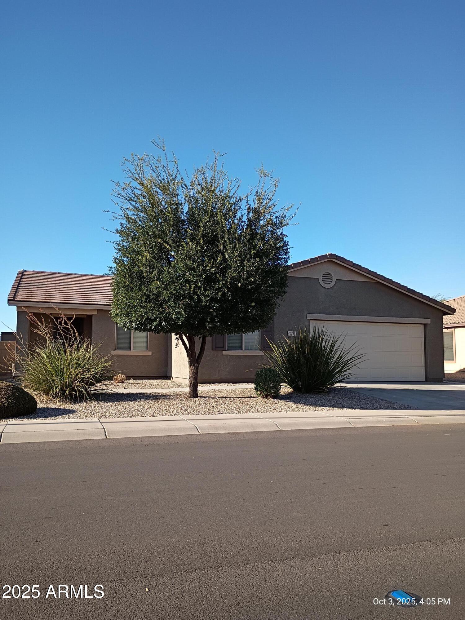 40214 West Lococo Street Maricopa, AZ 85138 - Photo 29 of 31 a house view with a outdoor space