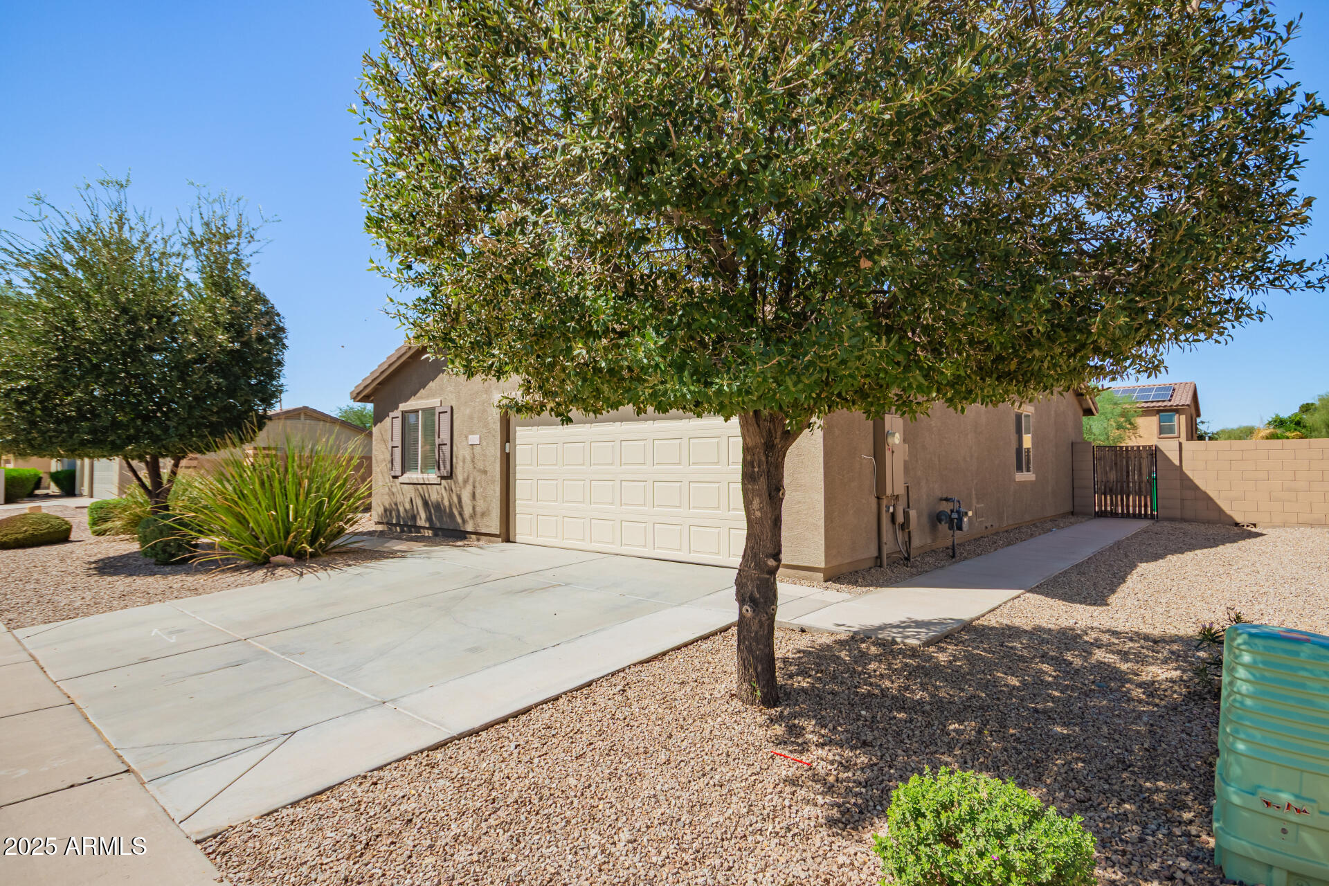 40214 West Lococo Street Maricopa, AZ 85138 - Photo 31 of 31 a white house that has a tree in front of it