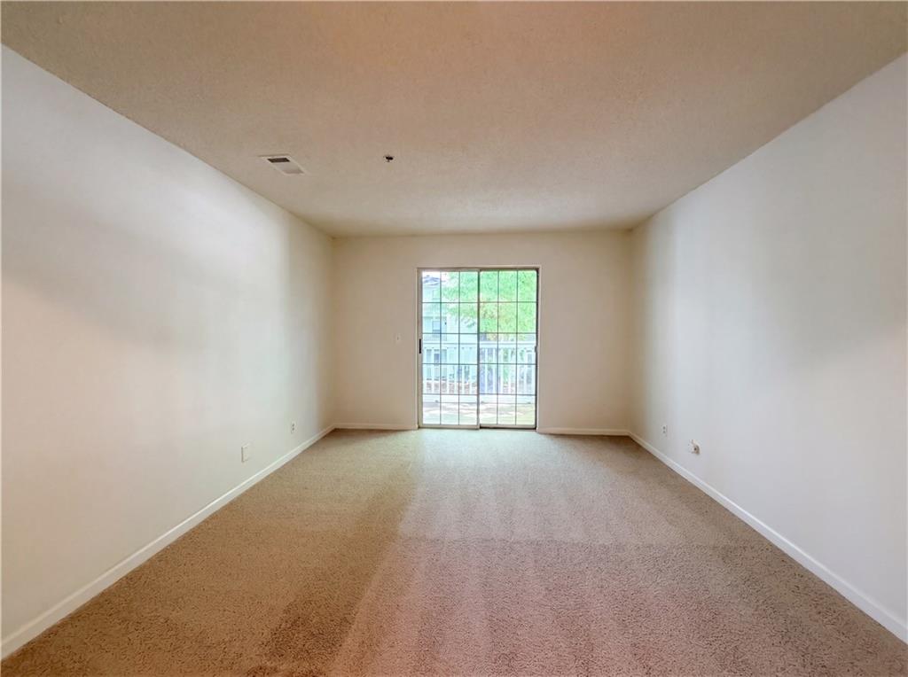 573 Cobblestone Trail Avondale Estates, GA 30002 - Photo 12 of 23 a view of an empty room with a window