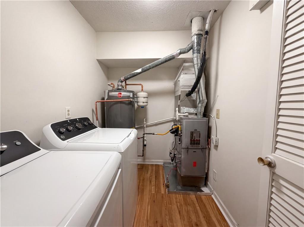 573 Cobblestone Trail Avondale Estates, GA 30002 - Photo 18 of 23 a utility room with dryer and washer