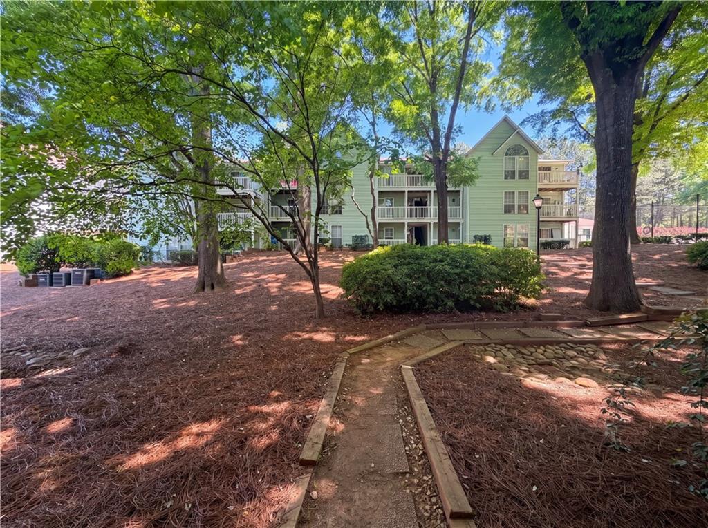 573 Cobblestone Trail Avondale Estates, GA 30002 - Photo 23 of 23 a view of a tree in front of a house