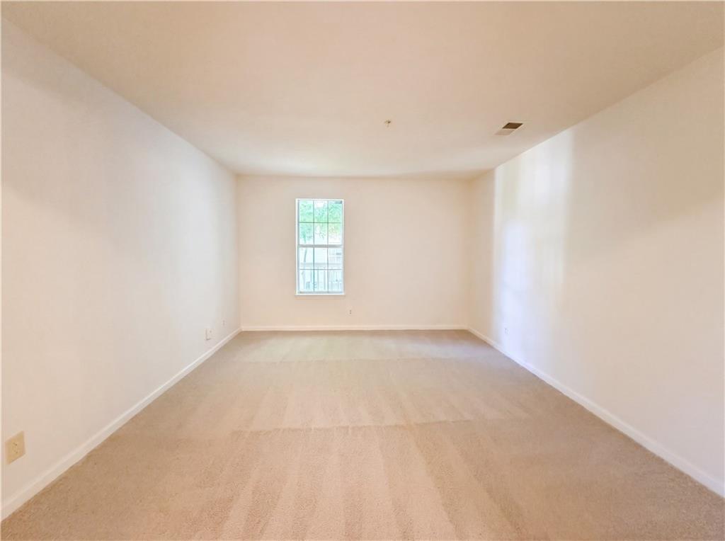 573 Cobblestone Trail Avondale Estates, GA 30002 - Photo 10 of 23 a view of an empty room with a window