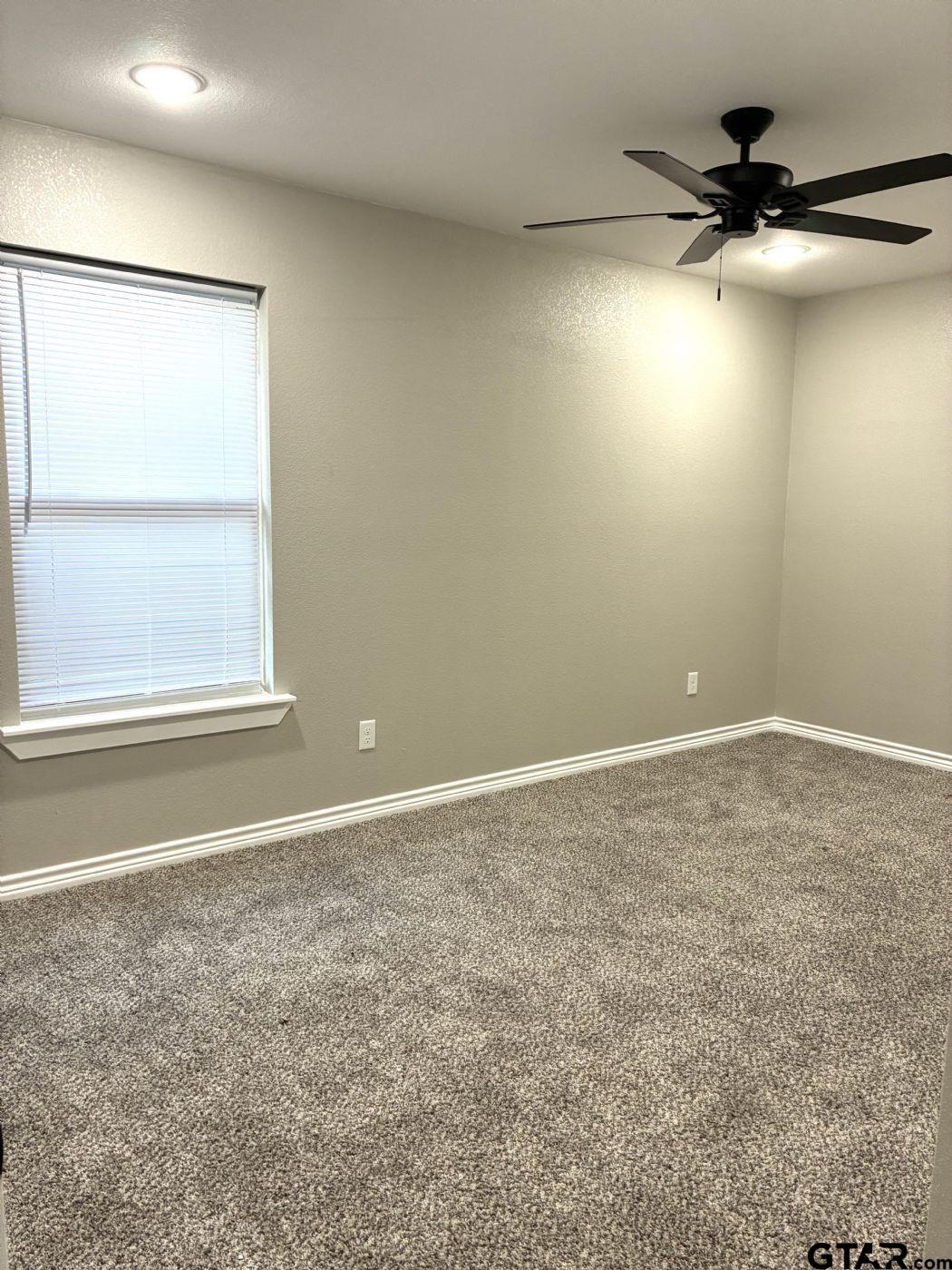 1607 North Ross Avenue Tyler, TX 75702 - Photo 6 of 10 an empty room with a window