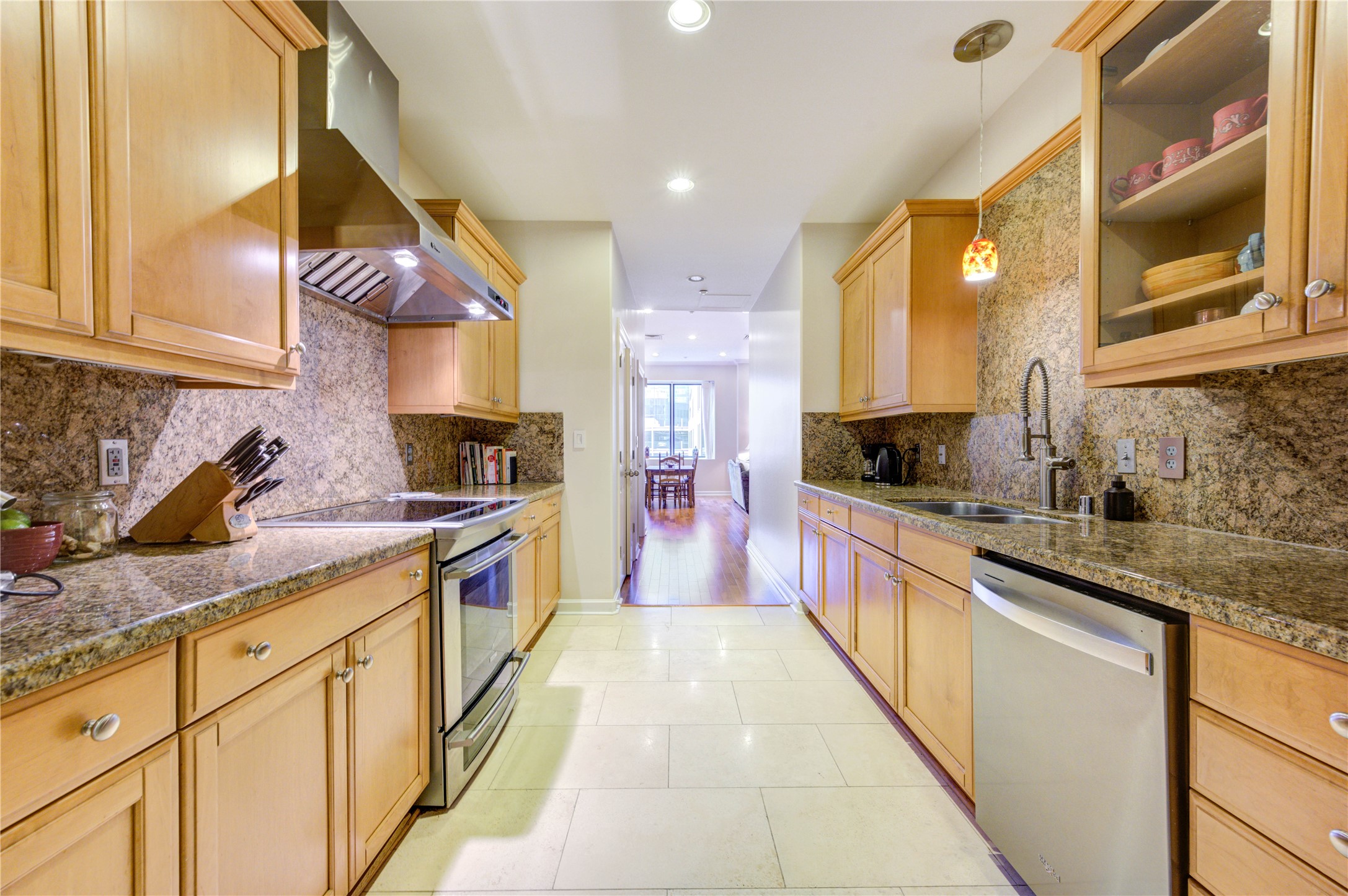 914 Main Street, Unit 911 Houston, TX 77002 - Photo 13 of 30 a large kitchen with stainless steel appliances lots of counter space and a sink