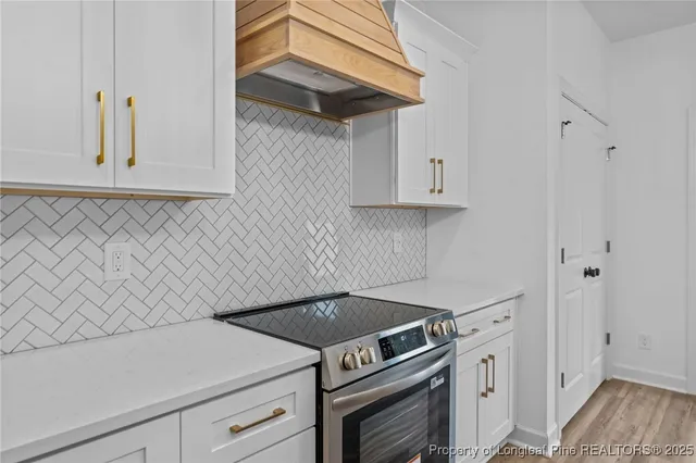 a kitchen with a stove and a microwave