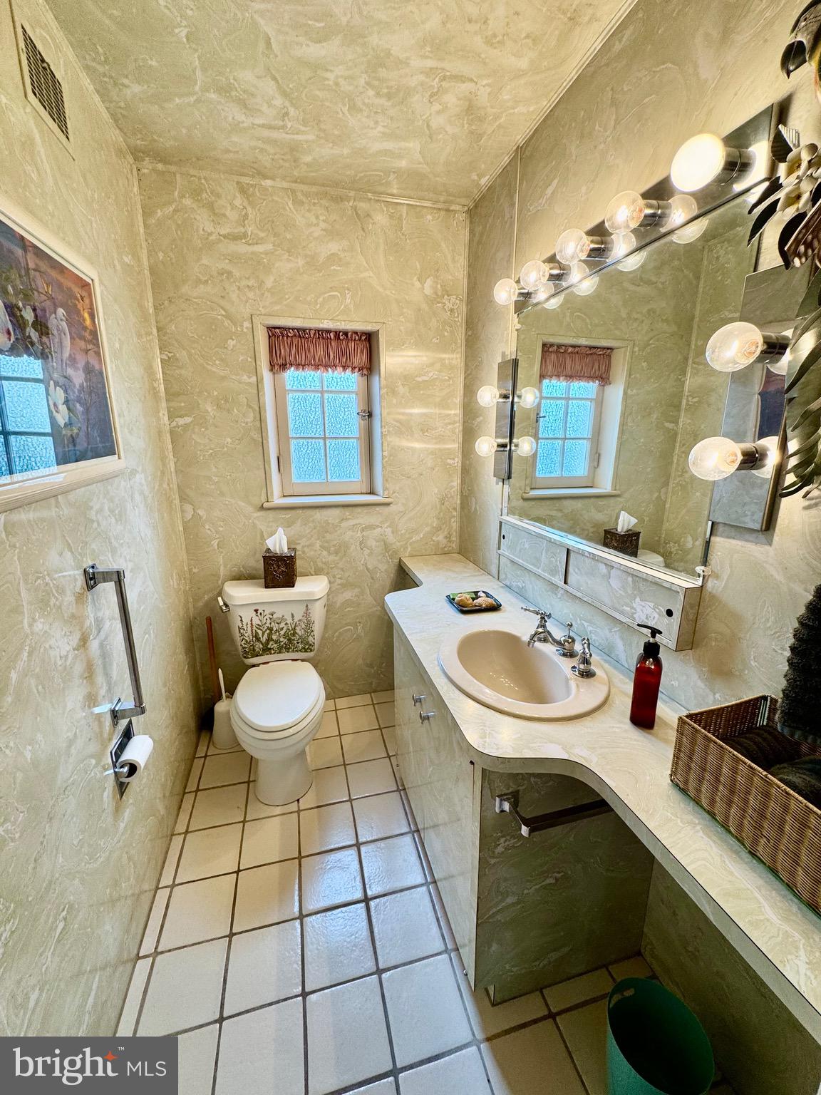 2251 Moore Street Huntingdon, PA 16652 - Photo 48 of 106 a bathroom with a sink toilet and mirror