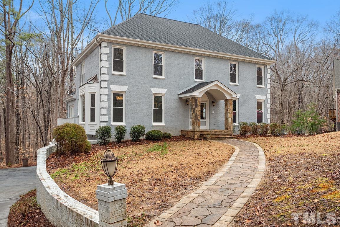 9132 Sutherland Court Raleigh, NC 27615 - Photo 1 of 36 a front view of a house with a yard