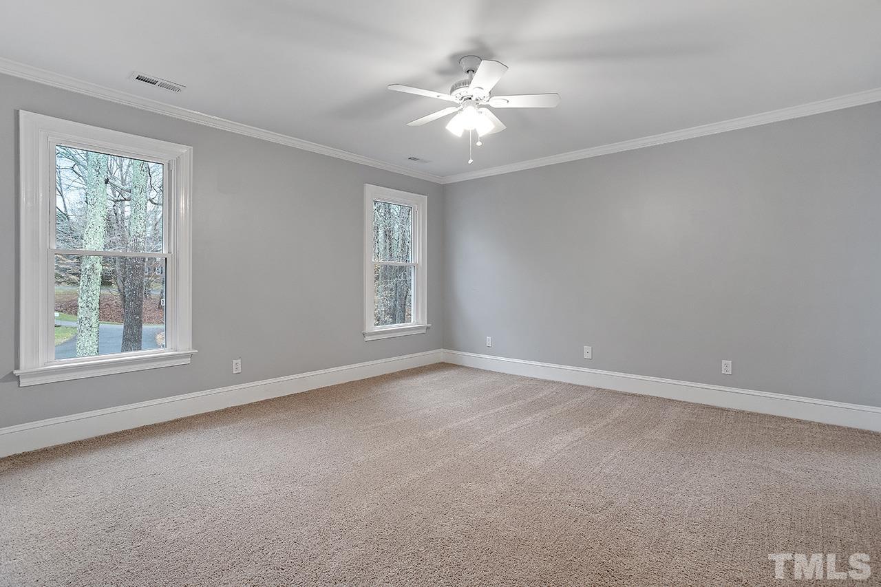 9132 Sutherland Court Raleigh, NC 27615 - Photo 24 of 36 a view of an empty room with a window