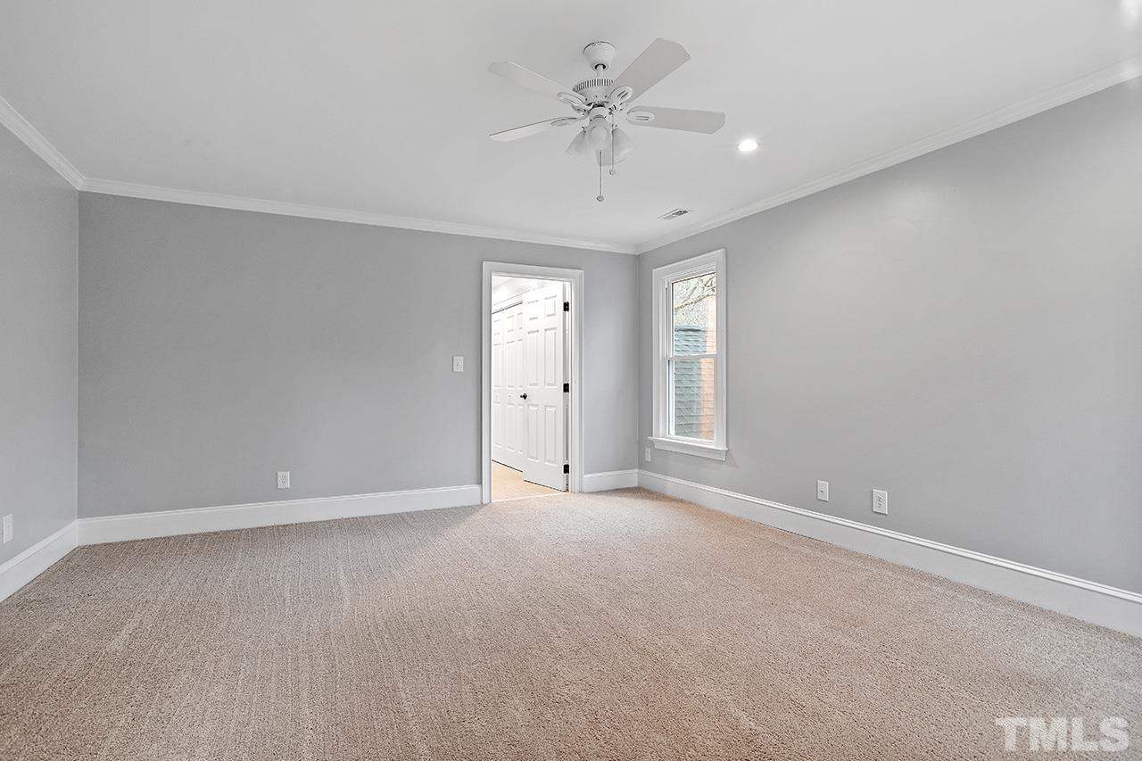 9132 Sutherland Court Raleigh, NC 27615 - Photo 26 of 36 a view of an empty room with a window