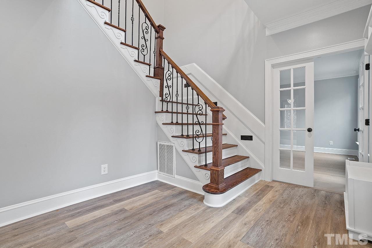9132 Sutherland Court Raleigh, NC 27615 - Photo 3 of 36 a view of entryway and hall with wooden floor