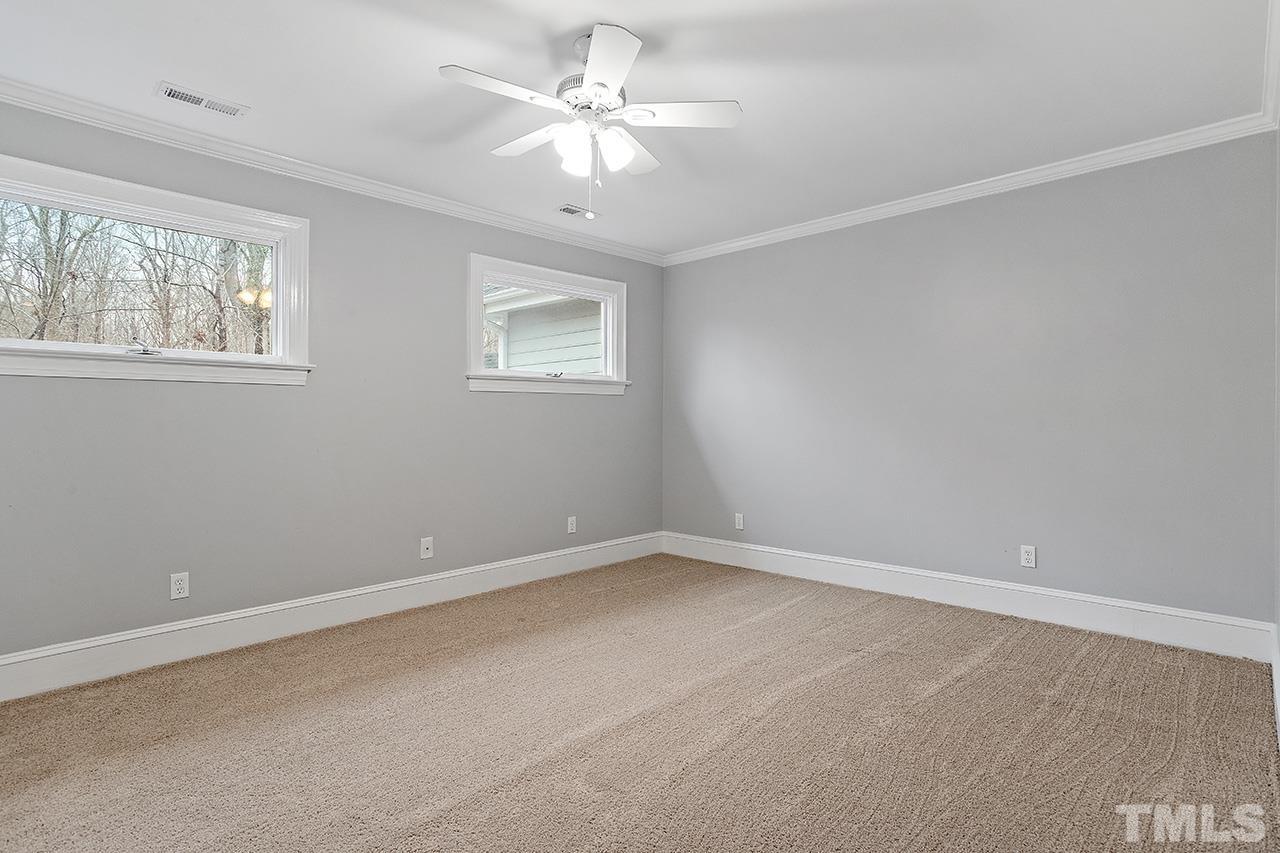 9132 Sutherland Court Raleigh, NC 27615 - Photo 36 of 36 an empty room with a window