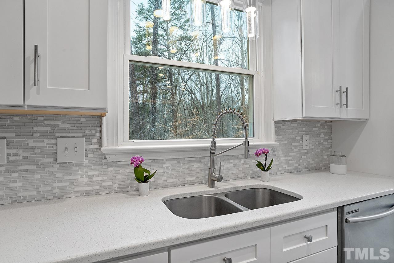 9132 Sutherland Court Raleigh, NC 27615 - Photo 10 of 36 a kitchen with a sink and a window
