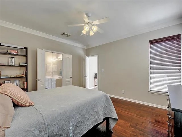 1832 Nelson Ranch Loop Cedar Park, TX 78613 - Photo 8 of 15 Hardwood flooring extends through this generously sized primary bedroom with private bathroom access.