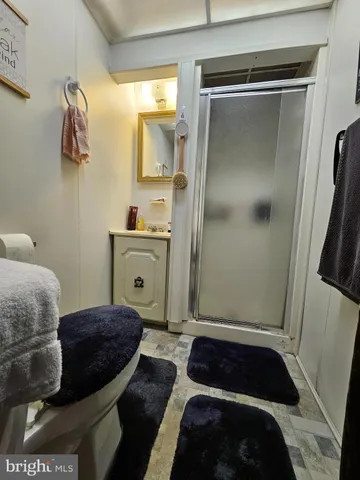 a room with a bed and a mirror