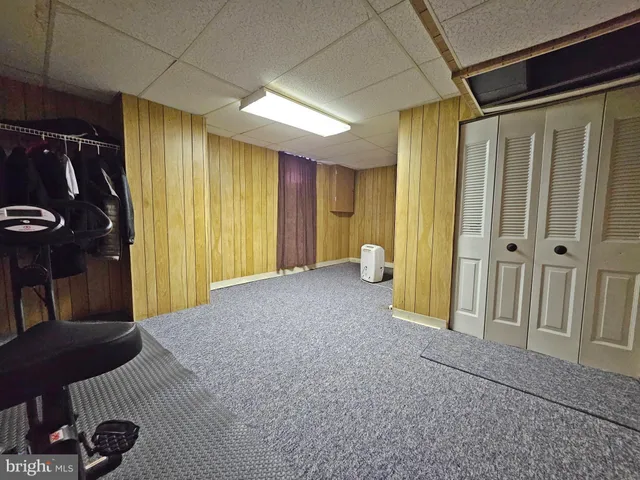 a kitchen with refrigerator and cabinets