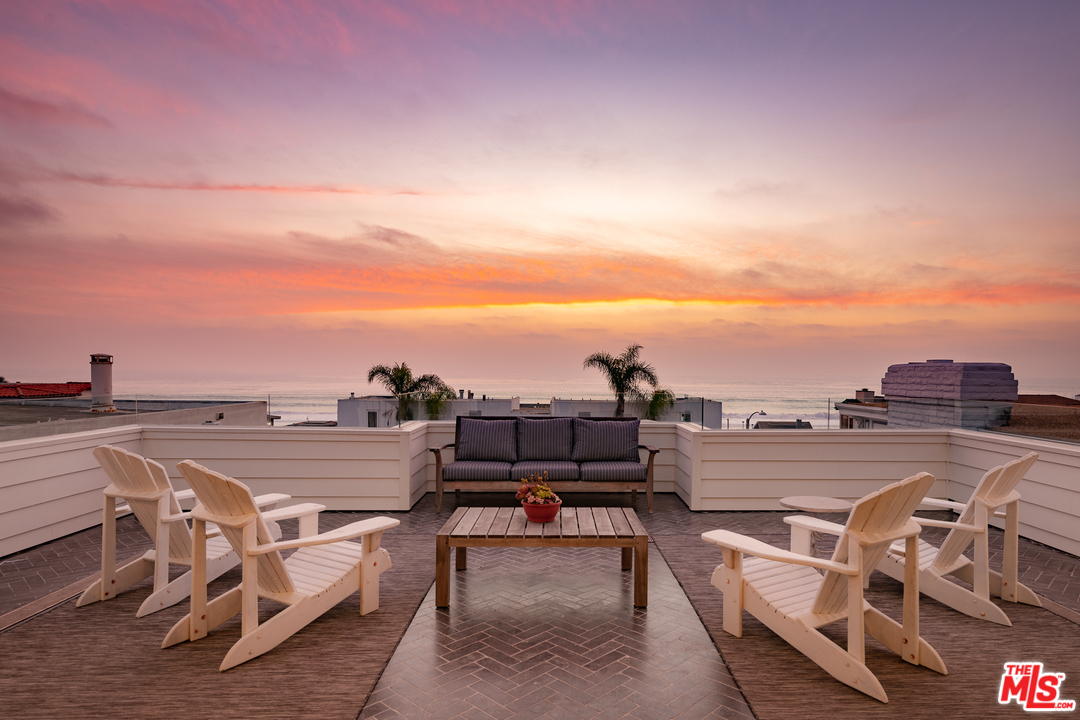 703 Bayview Drive Manhattan Beach, CA 90266 - Photo 1 of 30 a view of a terrace with lawn chairs
