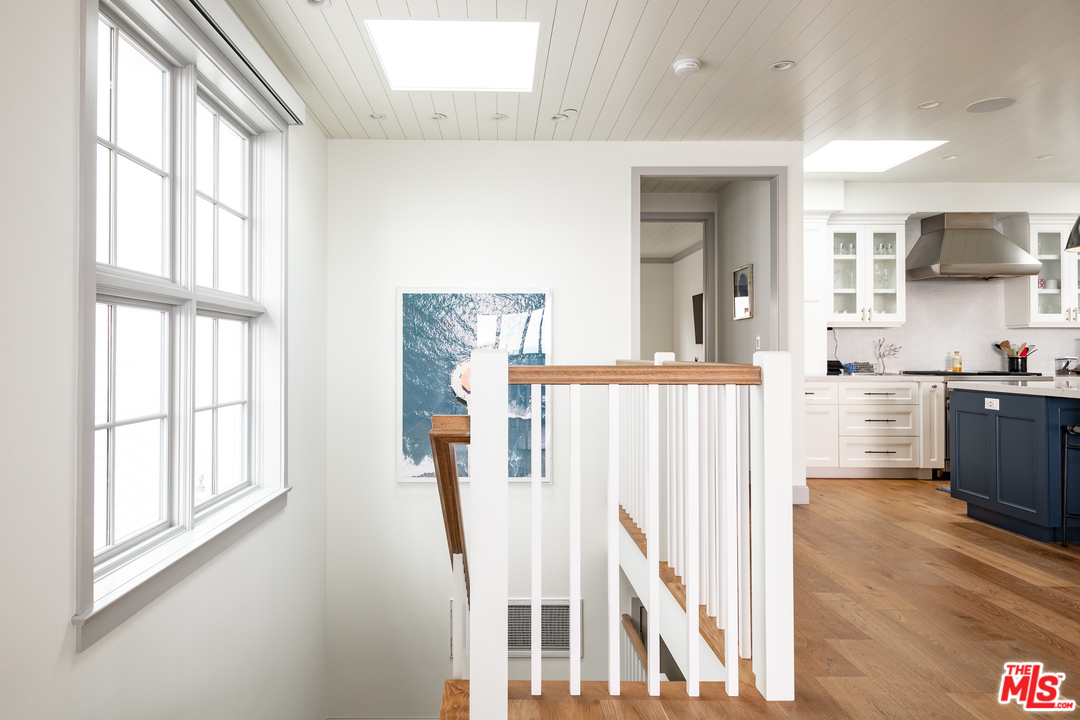 703 Bayview Drive Manhattan Beach, CA 90266 - Photo 13 of 30 a living room with a large window and wooden floor