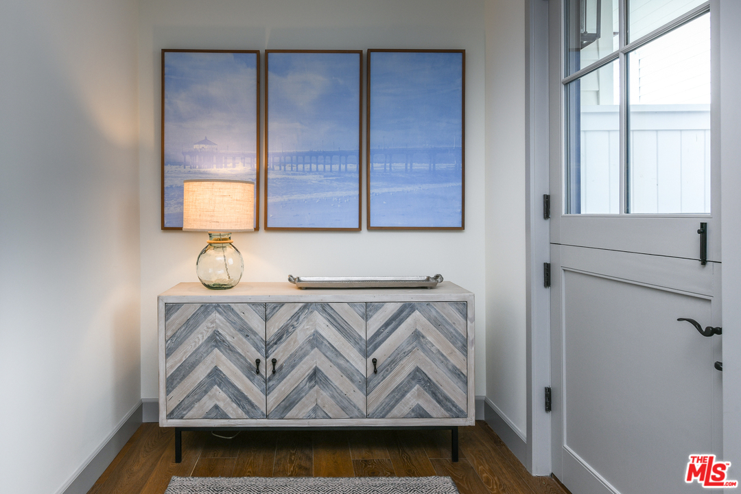 703 Bayview Drive Manhattan Beach, CA 90266 - Photo 14 of 30 a view of storage and utility room with wooden floor