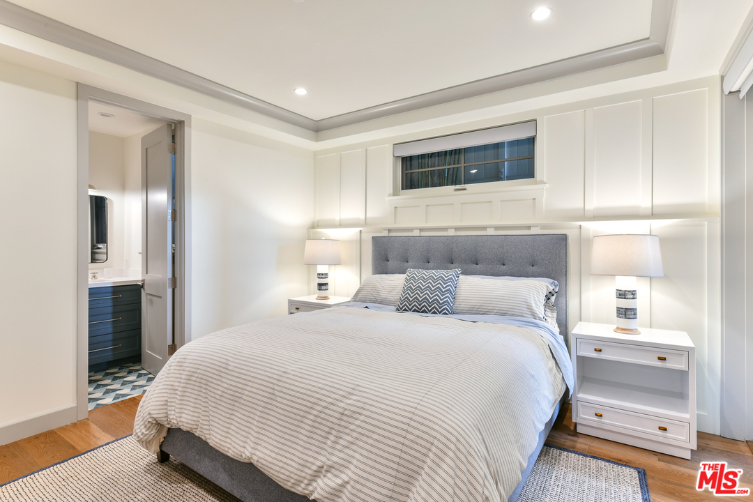 703 Bayview Drive Manhattan Beach, CA 90266 - Photo 20 of 30 a bedroom with a large bed and a tv