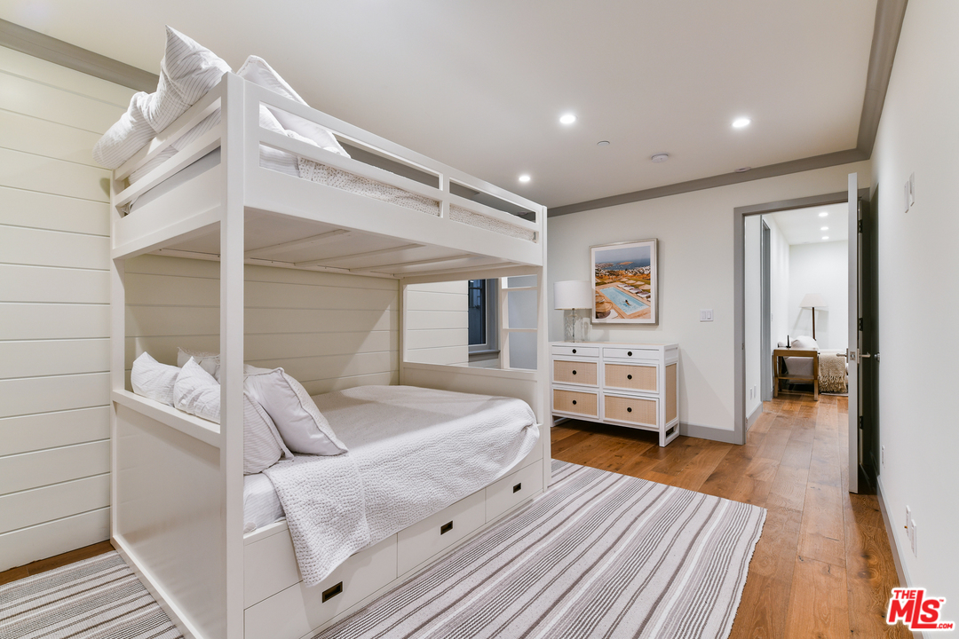 703 Bayview Drive Manhattan Beach, CA 90266 - Photo 22 of 30 a bedroom with furniture and a wooden floor