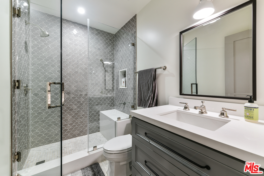 703 Bayview Drive Manhattan Beach, CA 90266 - Photo 24 of 30 a bathroom with a sink toilet and shower