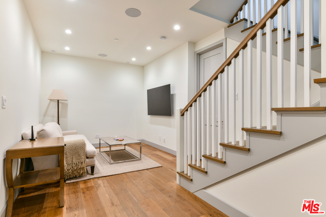 703 Bayview Drive Manhattan Beach, CA 90266 - Photo 25 of 30 a living room with furniture and stairs