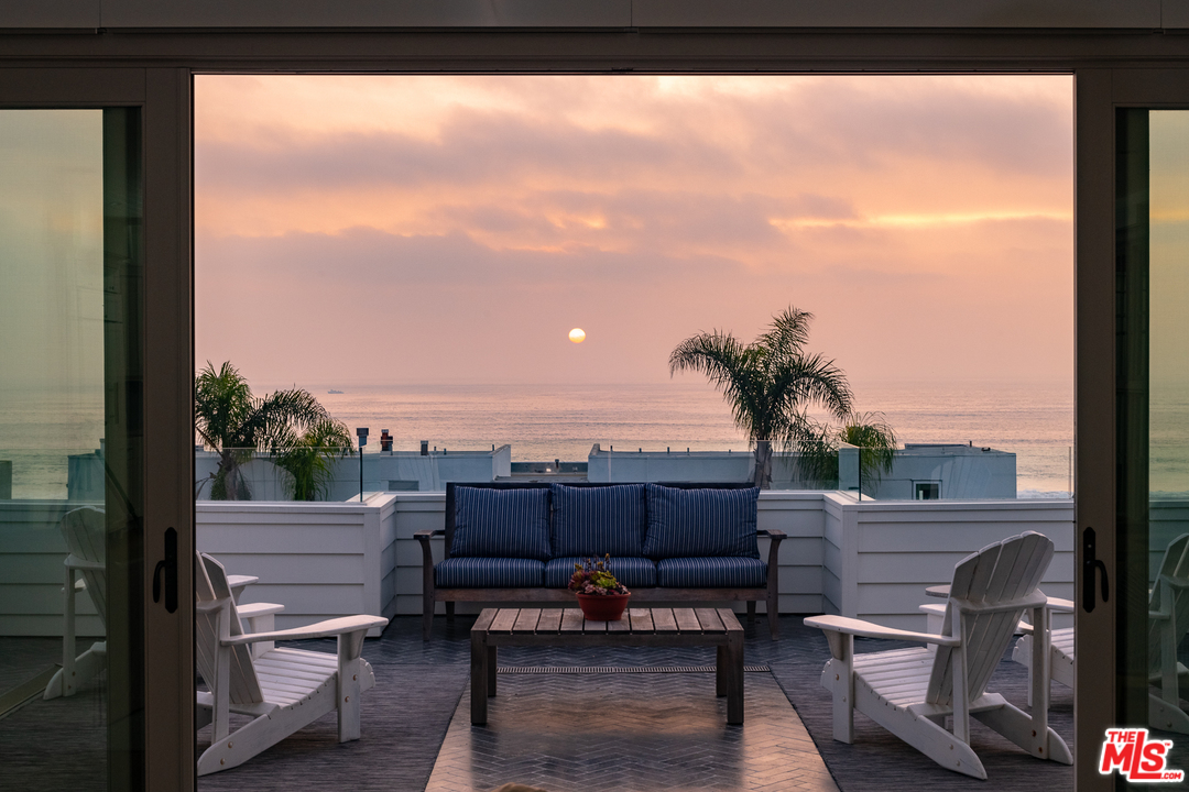 703 Bayview Drive Manhattan Beach, CA 90266 - Photo 30 of 30 a view of a balcony with chairs and wooden fence