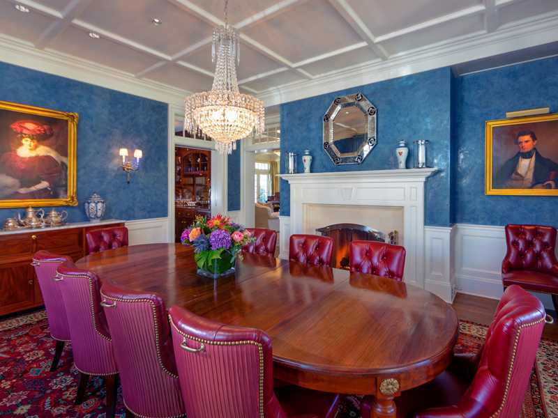 107 Long Neck Point Road Darien, CT 06820 - Photo 11 of 25 a view of a dining room with furniture and chandelier