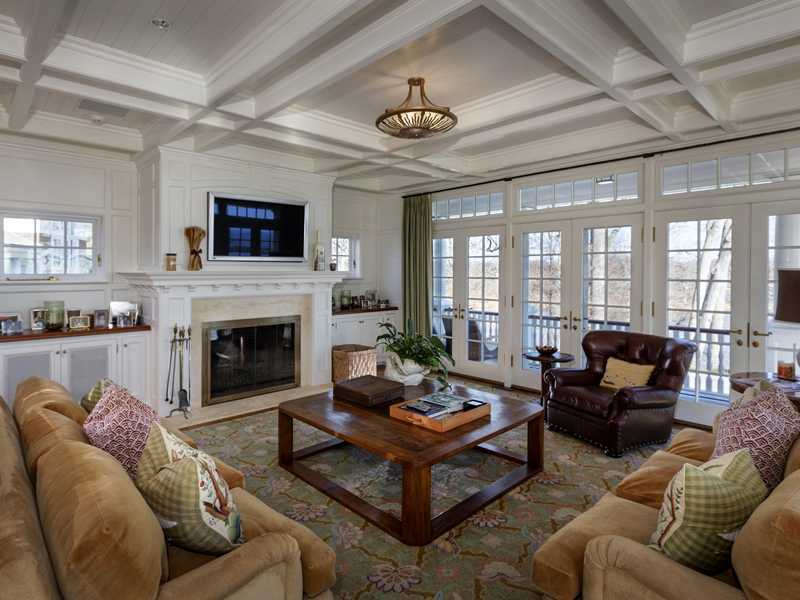 107 Long Neck Point Road Darien, CT 06820 - Photo 13 of 25 a living room with furniture fireplace and a large window