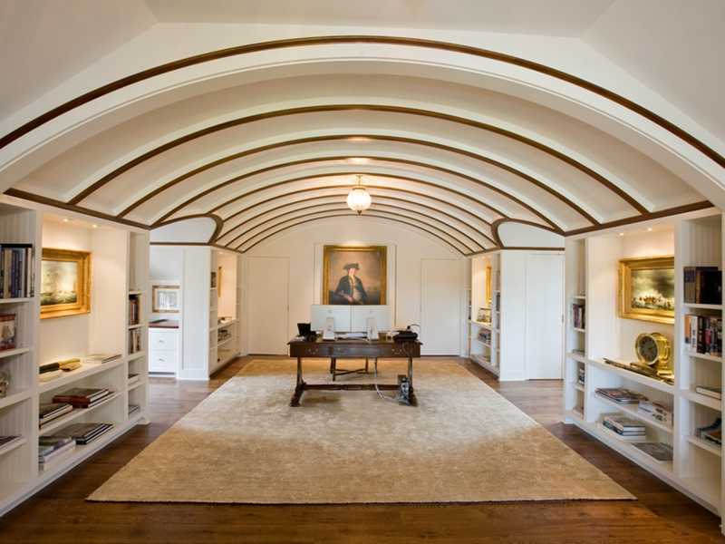 107 Long Neck Point Road Darien, CT 06820 - Photo 21 of 25 a living room with furniture and a fireplace