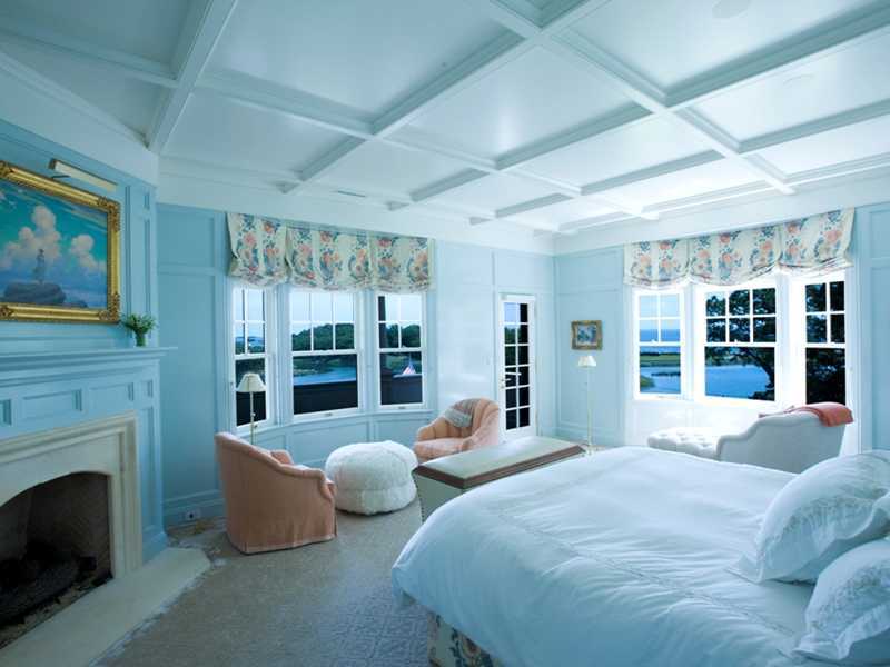 107 Long Neck Point Road Darien, CT 06820 - Photo 22 of 25 a spacious bedroom with a large bed and a large window