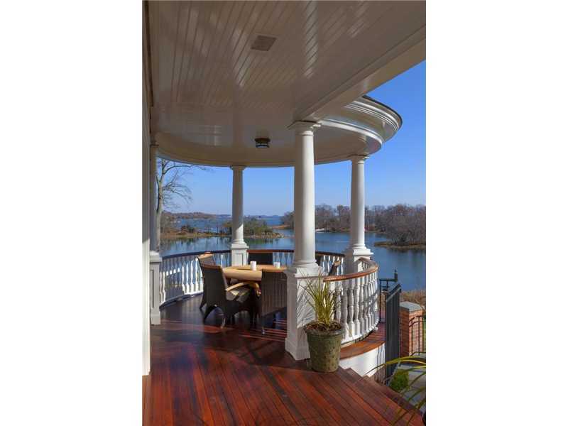 107 Long Neck Point Road Darien, CT 06820 - Photo 5 of 25 a living room with furniture and a floor to ceiling window