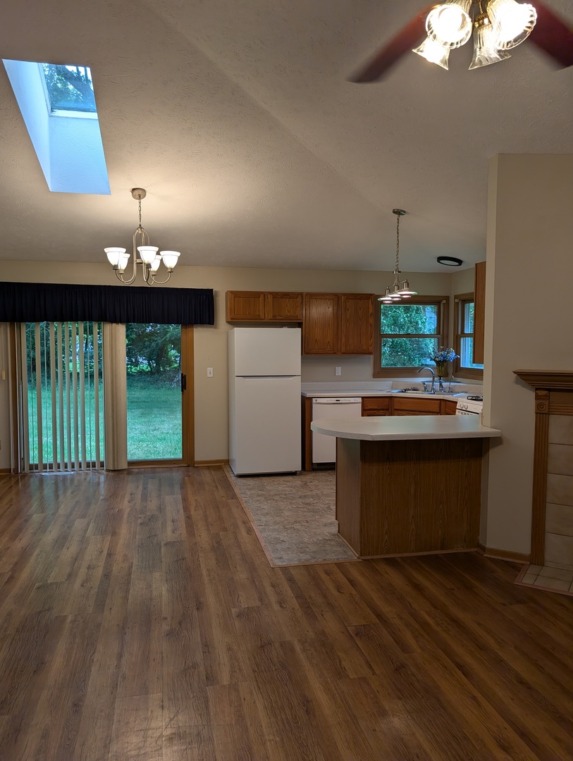 430 Pembroke Road Southwest Poplar Grove, IL 61065 - Photo 6 of 20 a view of a kitchen with a sink and a stove