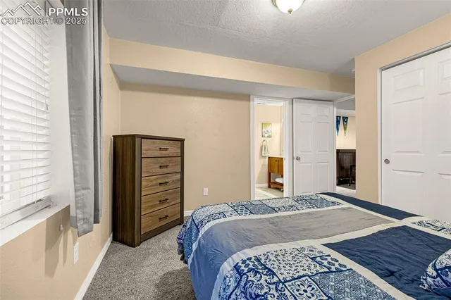 a bedroom with a bed and a cabinets