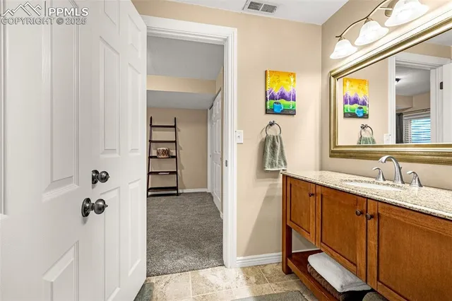 a bathroom with a sink a vanity and a mirror