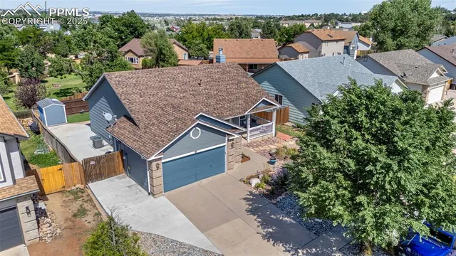 an aerial view of house with yard
