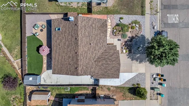an aerial view of a house with a garden