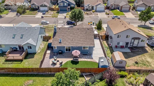 an aerial view of residential houses with outdoor space
