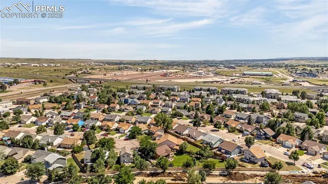 an aerial view of residential building and ocean