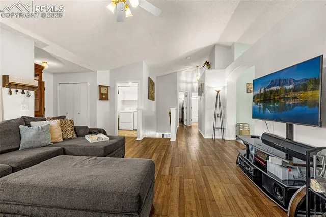 a living room with furniture and a flat screen tv