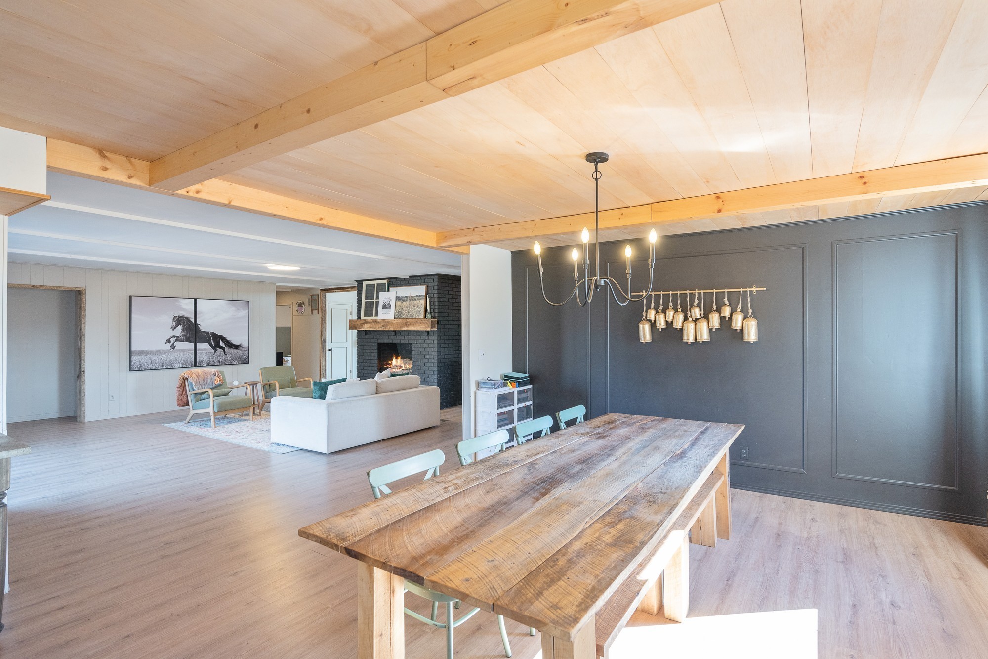 3080 Bible Hill Road Parsons, TN 38363 - Photo 20 of 76 a dining room with wooden floor a chandelier a wooden table and chairs