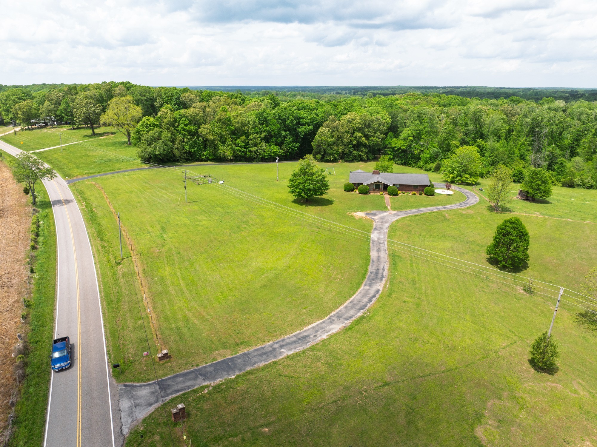 3080 Bible Hill Road Parsons, TN 38363 - Photo 2 of 76 a view of a swimming pool with a yard and outdoor seating