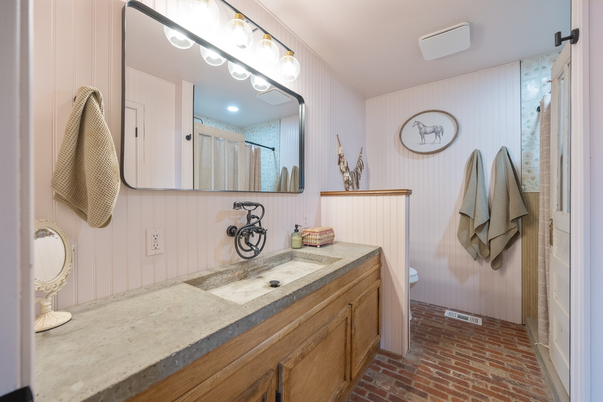3080 Bible Hill Road Parsons, TN 38363 - Photo 35 of 76 a bathroom with a sink and mirror