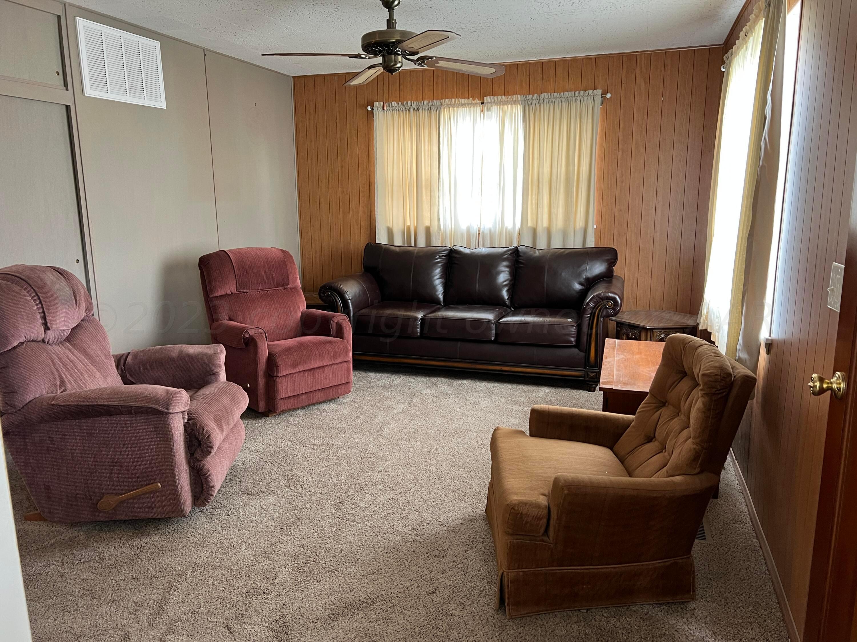 6012 Garden Lane Amarillo, TX 79106 - Photo 5 of 14 a living room with furniture and a window