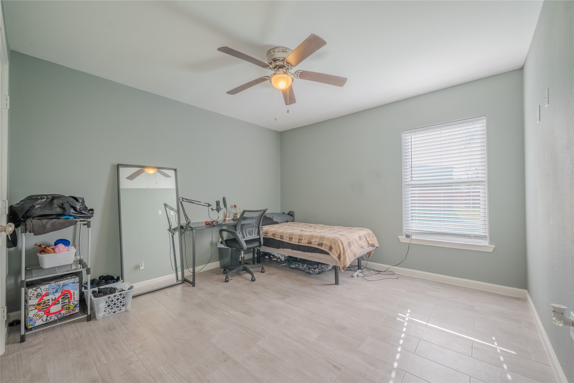 4340 Highway 60 Wharton, TX 77488 - Photo 22 of 49 Proportioned for comfort, this bedroom utilizes muted tones and daylight to maximize the serene country views.